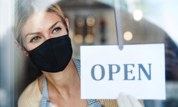 Woman touching the open sign